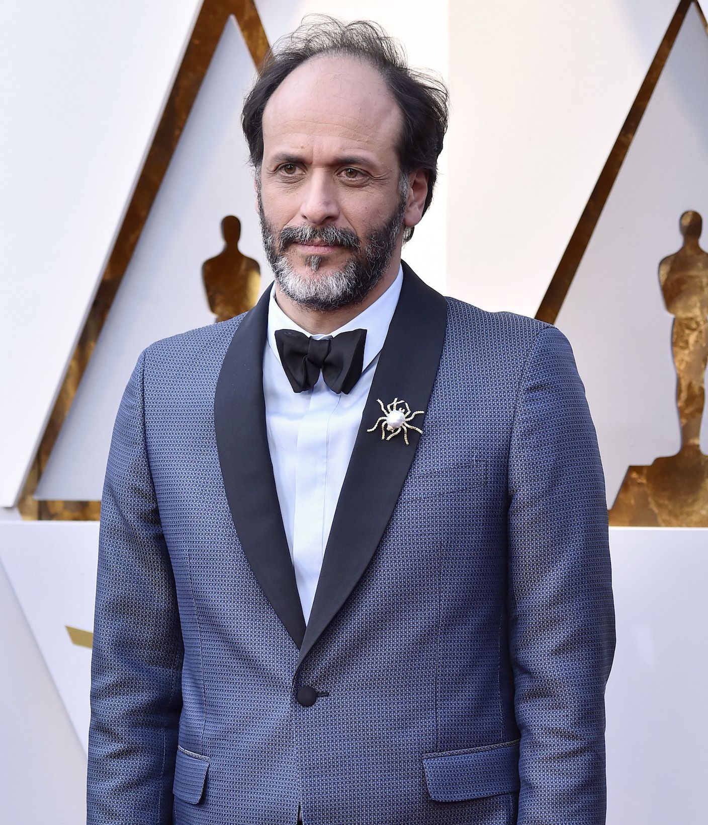 Director Luca Guadagnino wore a spider brooch in yellow and white gold with diamonds and baroque pearls by Buccellati. (Photo: Courtesy of Buccellati)