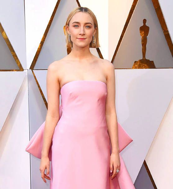 Saoirse Ronan wore diamond earrings set in platinum from Cartier’s Diamond Collection, and a Cartier vintage ring in white gold set with diamonds. (Photo: Courtesy of Getty Images)