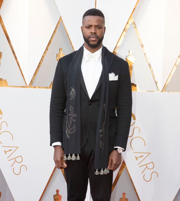 Winston Duke wore a Rotonde de Cartier watch and Trinity cufflinks in white gold, ceramic and diamonds by Cartier. (Photo: Courtesy of Getty Images)