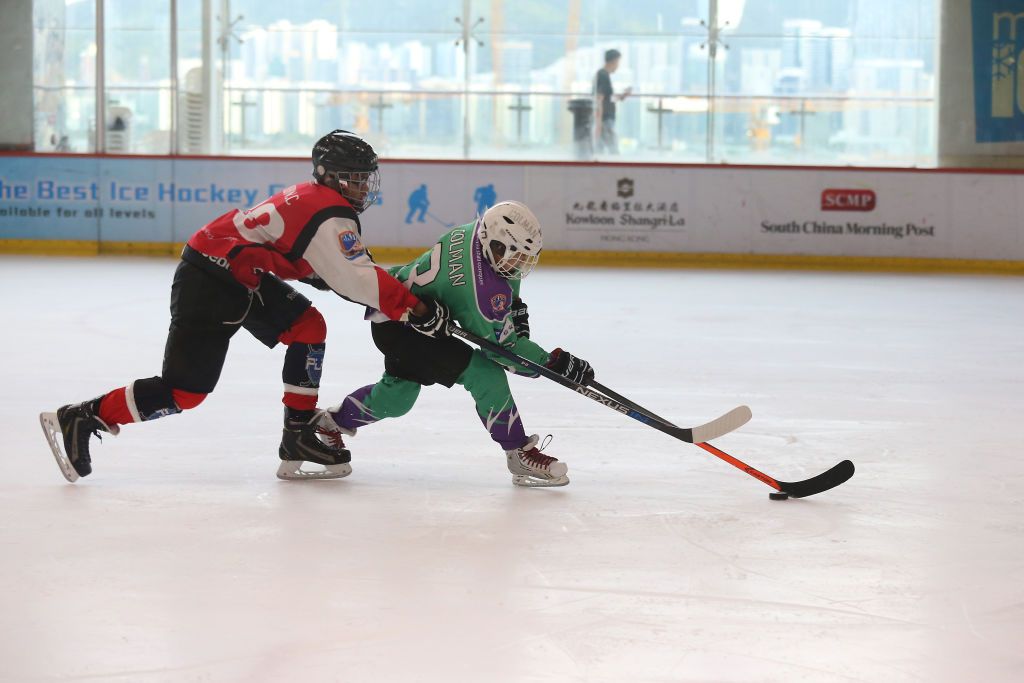 PLK Tong Nai Kan Junior Secondary College (Red) and Wah Yan, Kowloon Team 2 (Green) in action at Hong Kong School Ice Hockey League High school Championship Game at MegaBox in Kowloon Bay. 30JUN16 SCMP/K. Y. Cheng (Photo by K. Y. Cheng/South China Morning Post via Getty Images)