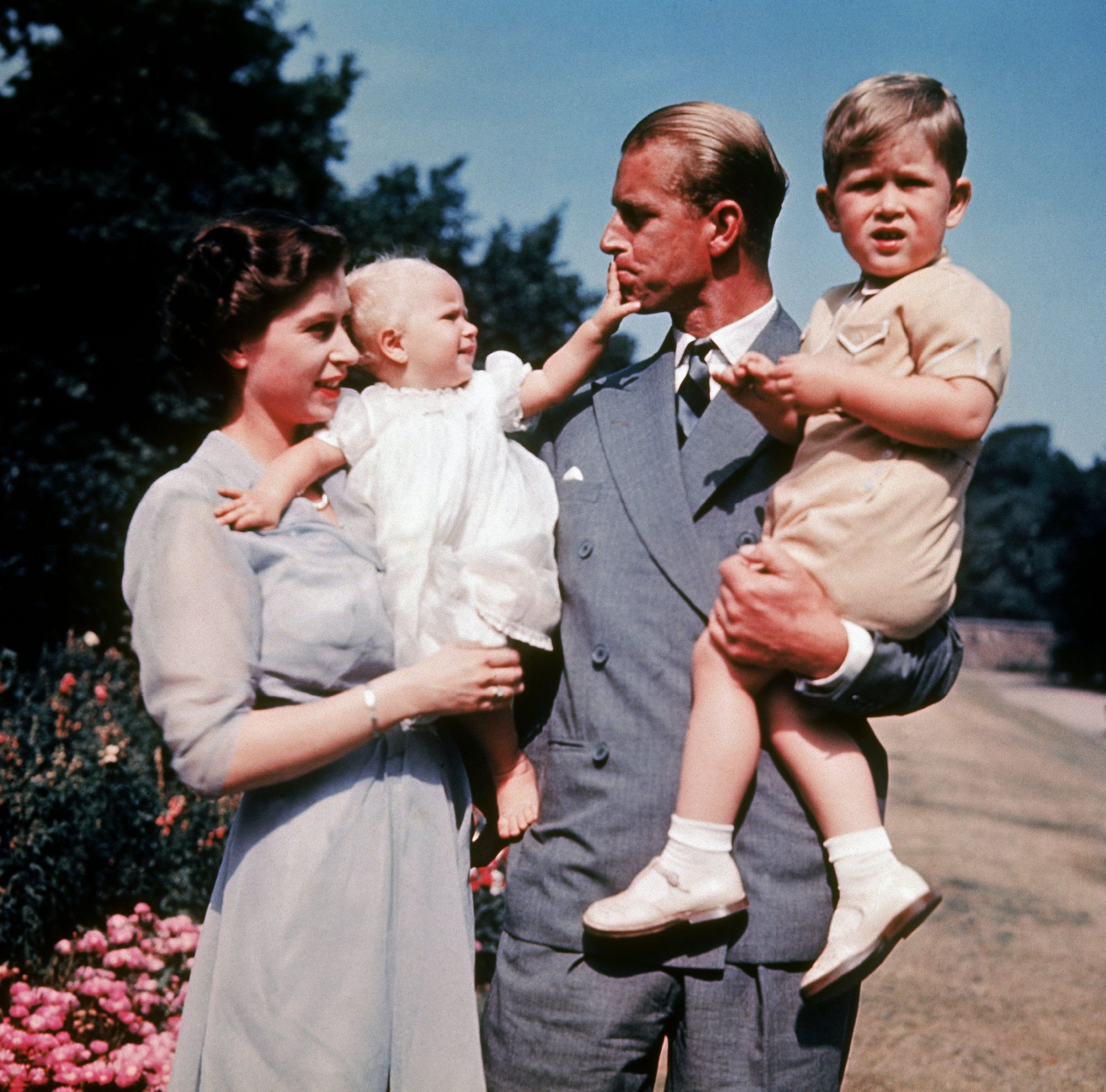 UNITED KINGDOM - JANUARY 01: The first color photograph of Princess ANNE, taken in 1951, in the arms of her mother Queen ELIZABETH II while her father, Philip MOUNTBATTEN, holds her brother Prince CHARLES. (Photo by Keystone-France/Gamma-Keystone via Getty Images)