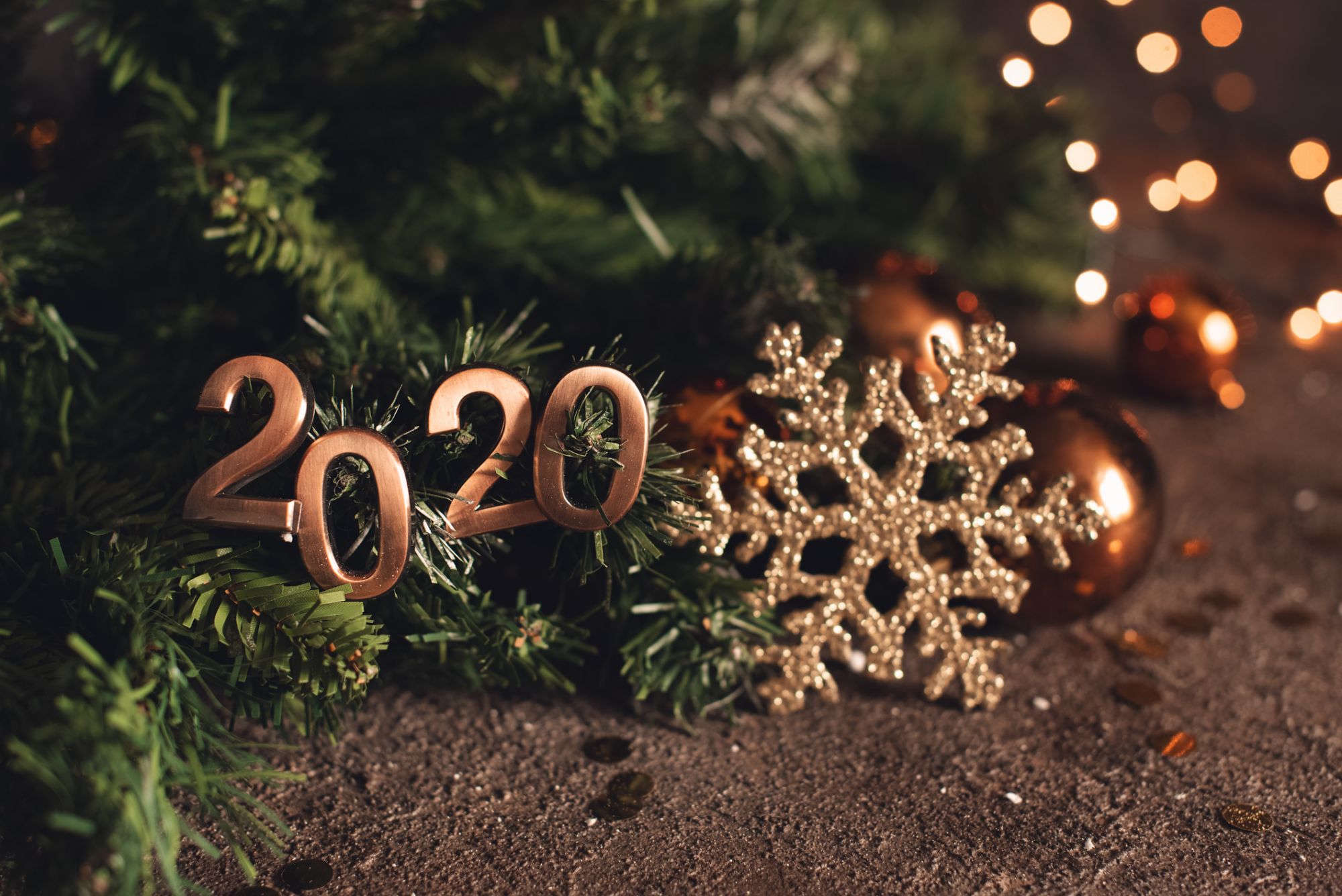 2020 new year eve trip.top view putting happy new year number on wood table with adventure accessory item,holiday vacation resolutions planning.