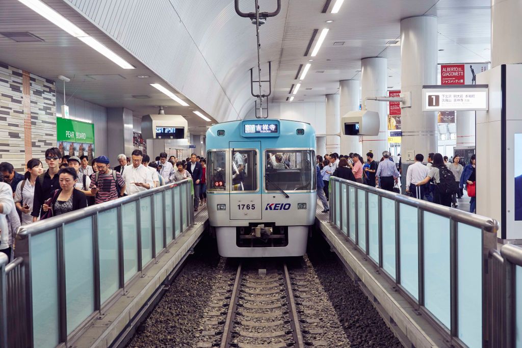 SHIBUYA, TOKYO, JAPAN - 2017/06/09: Commuters enter and leave a train at Tokyo's busy Shibuya station. The subway and train network in Tokyo is both extensive and confusing, with numerous companies operating different lines and routes. (Photo by Craig Ferguson/LightRocket via Getty Images)