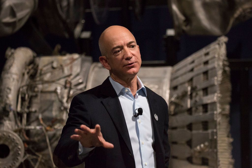 SEATTLE, WA - MAY 20, 2017: Jeff Bezos speaks near part of an F-1 engine from a Saturn V rocket, on display in the APOLLO exhibit at the Museum of Flight, in Seattle, Washington on May 20, 2017. Bezos paid for the recovery of portions of the engines, used for NASA's Apollo missions to the moon, which had been resting at the bottom of the ocean since the late 1960s and early 1970s. (Photo by David Ryder for The Washington Post via Getty Images)
