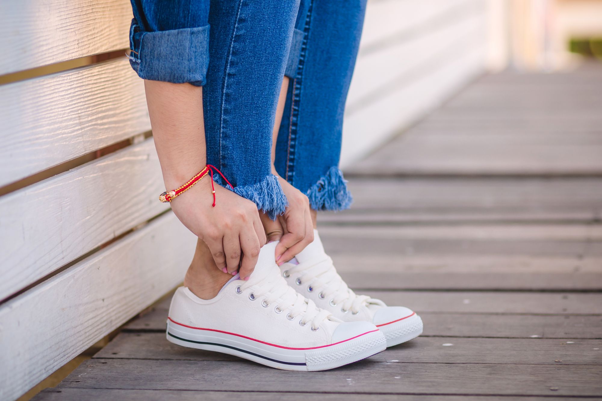 Close up of model in white sneakers