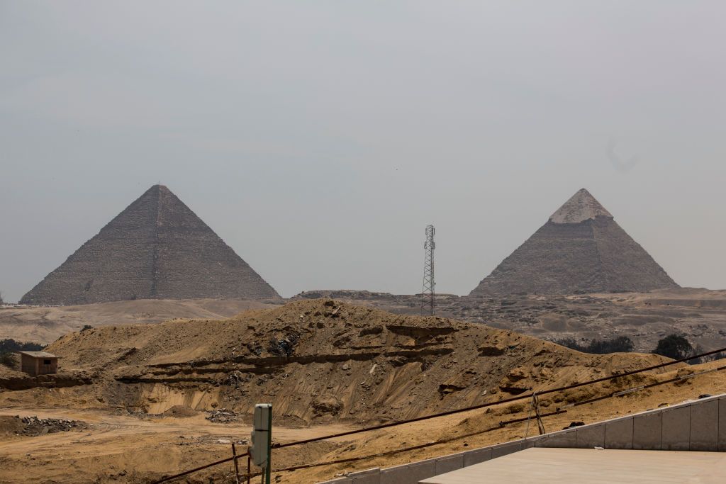 26 April 2018, Egypt, Giza: The construction site of the Grand Egyptian Museum is located in front of the Pyramids of Giza. The museum is supposed to set new standards with German assistance. However, the opening date for the megaproject might not work out. Photo: Gehad Hamdy/dpa (Photo by Gehad Hamdy/picture alliance via Getty Images)