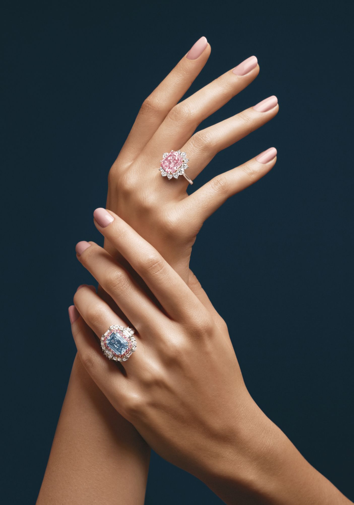 Ring in platinum set with a pink diamond and white diamonds; ring in platinum set with a blue diamond, pink diamonds and white diamonds, all by Harry Winston