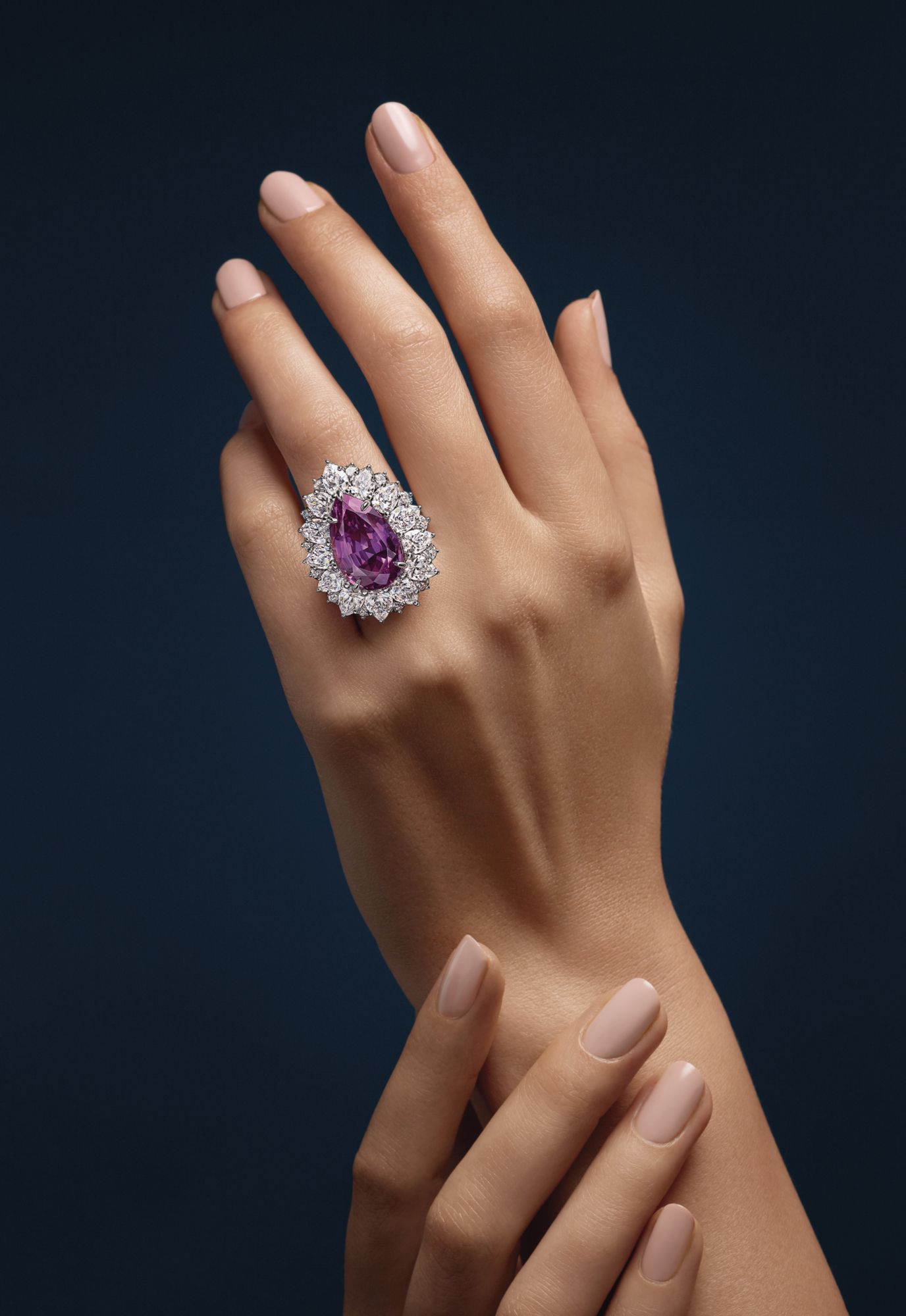 Ring in platinum set with a pink sapphire and diamonds by Harry Winston