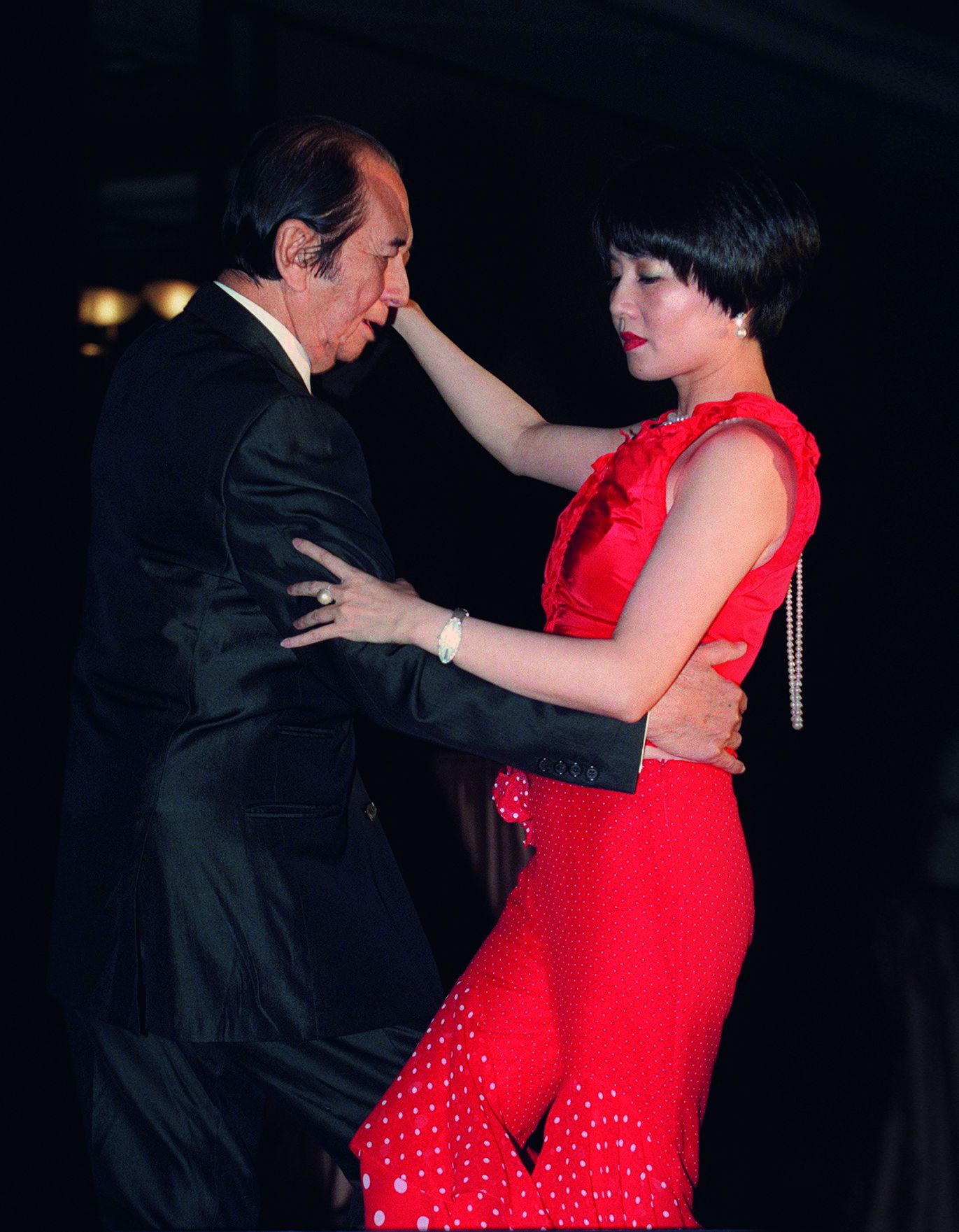 Dr. Stanley Ho Hung-sun and his fourth wife, Angela Leung On-kei, dance for a fund-raising event at the Hong Kong Journalists Association annual dinner. (Photo by K. Y. Cheng/South China Morning Post via Getty Images)