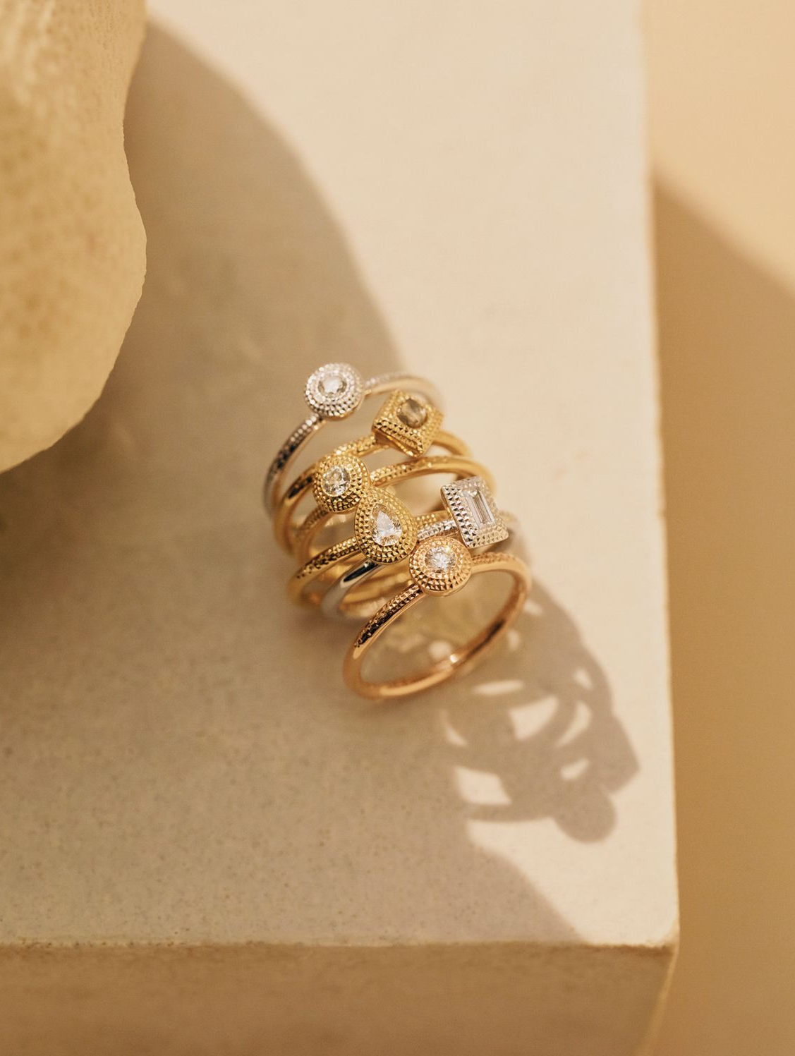 Talisman rings in yellow, rose and white gold set with diamonds by De Beers