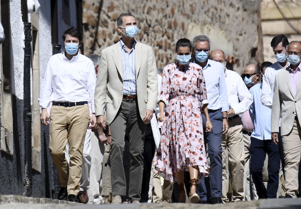 King Felipe of Spain and Queen Letizia of Spain wear face masks as they walk through Vinuesa, Spain (Photo by Carlos Alvarez/Getty Images)