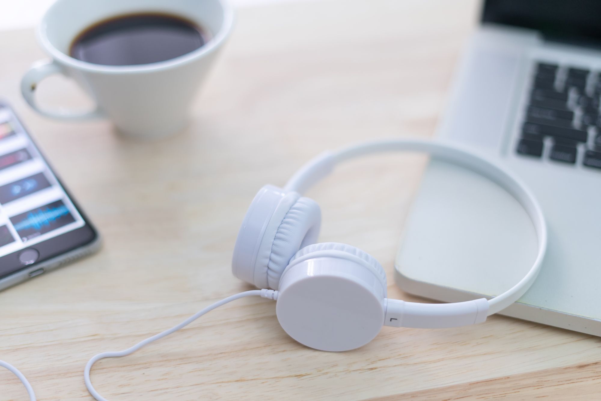 Headphone with Laptop on the table.