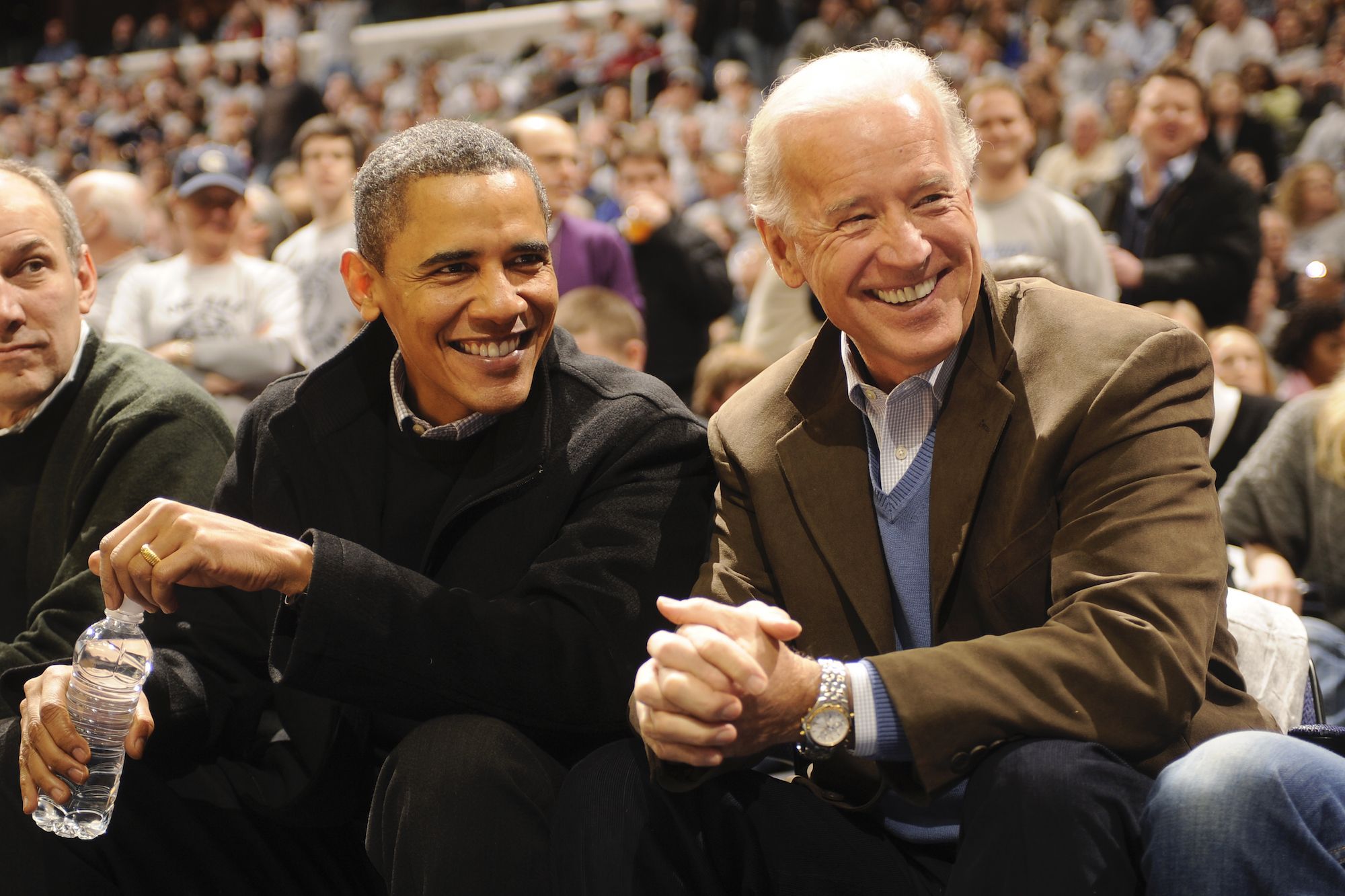 WASHINGTON - JANUARY 30: President of the United States Barack Obama and Vice President Joe Biden talk during a college basketball game between Georgetown Hoyas and the Duke Blue Devils on January 30, 2010 at the Verizon Center in Washington DC. (Photo by Mitchell Layton/Getty Images)