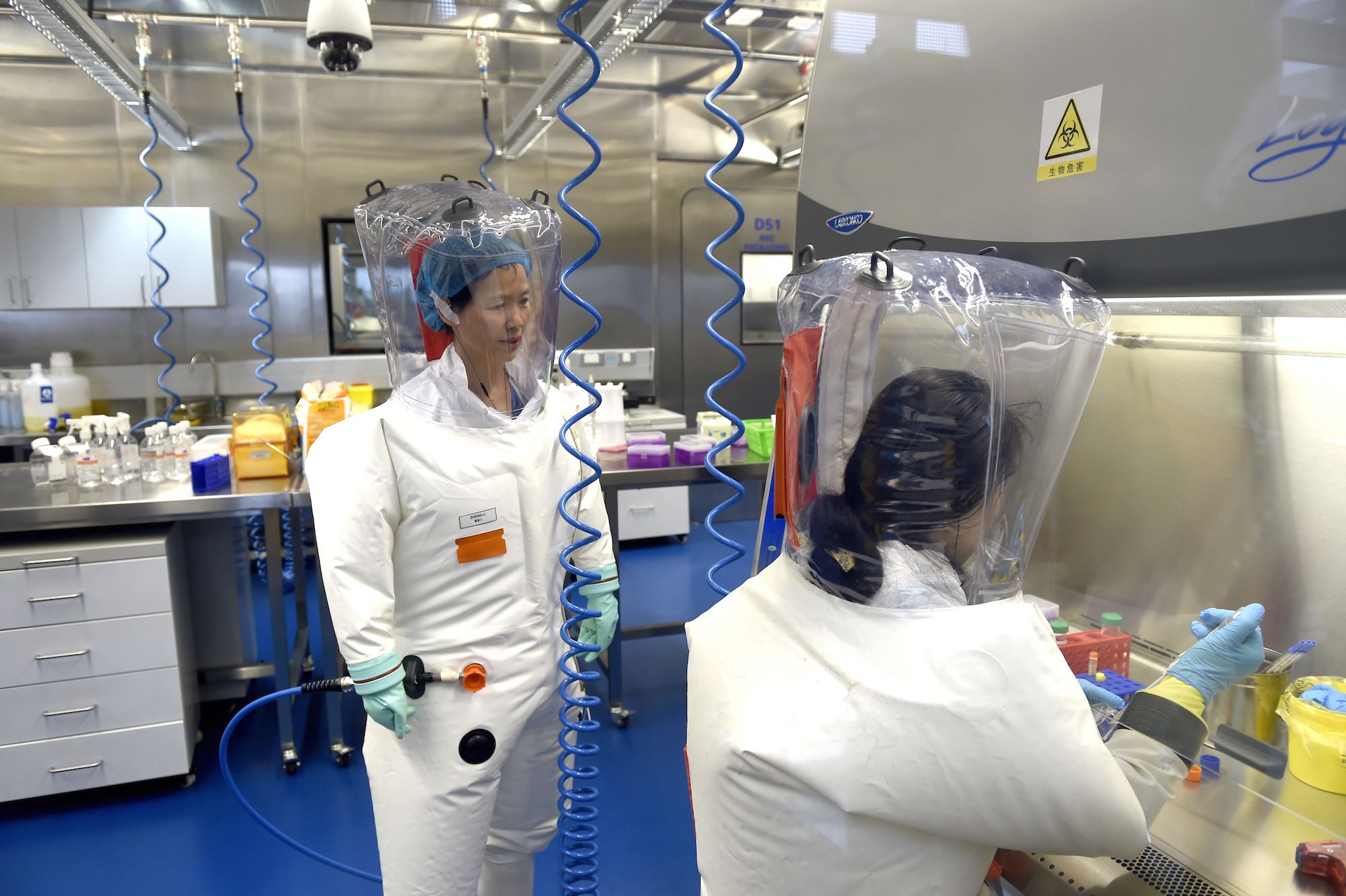 WUHAN, CHINA - FEBRUARY 23 2017: Virologist Shi Zheng-li, left, works with her colleague in the P4 lab of Wuhan Institute of Virology (WIV) in Wuhan in central China's Hubei province Thursday, Feb. 23, 2017.