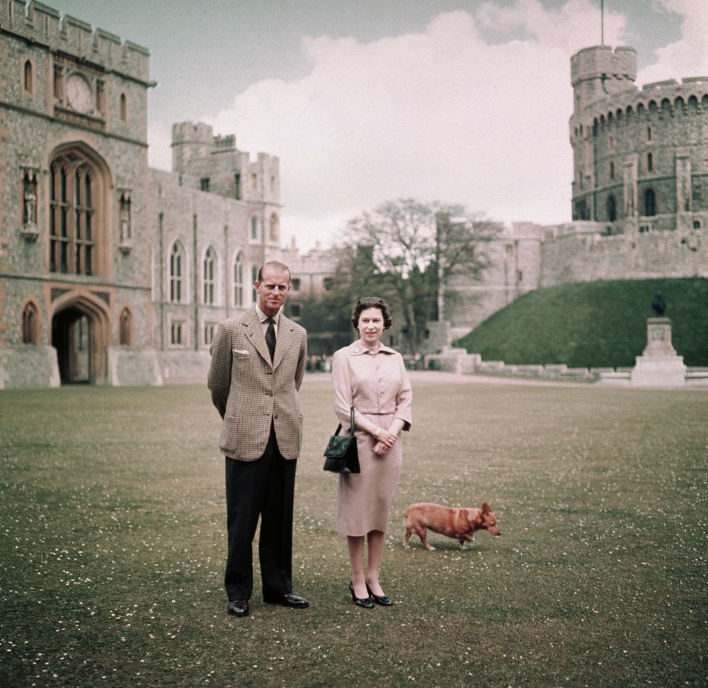 Queen Elizabeth and Prince Philip at Windsor Castle with her corgi, photographed in 1959 (photo: Getty Images)