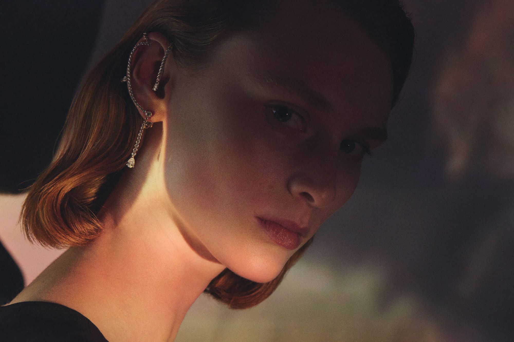 Mono earring in rose gold set with black jade, smoked quartz cabochon, tourmaline cabochon, imperial topaz and diamonds by Hermès