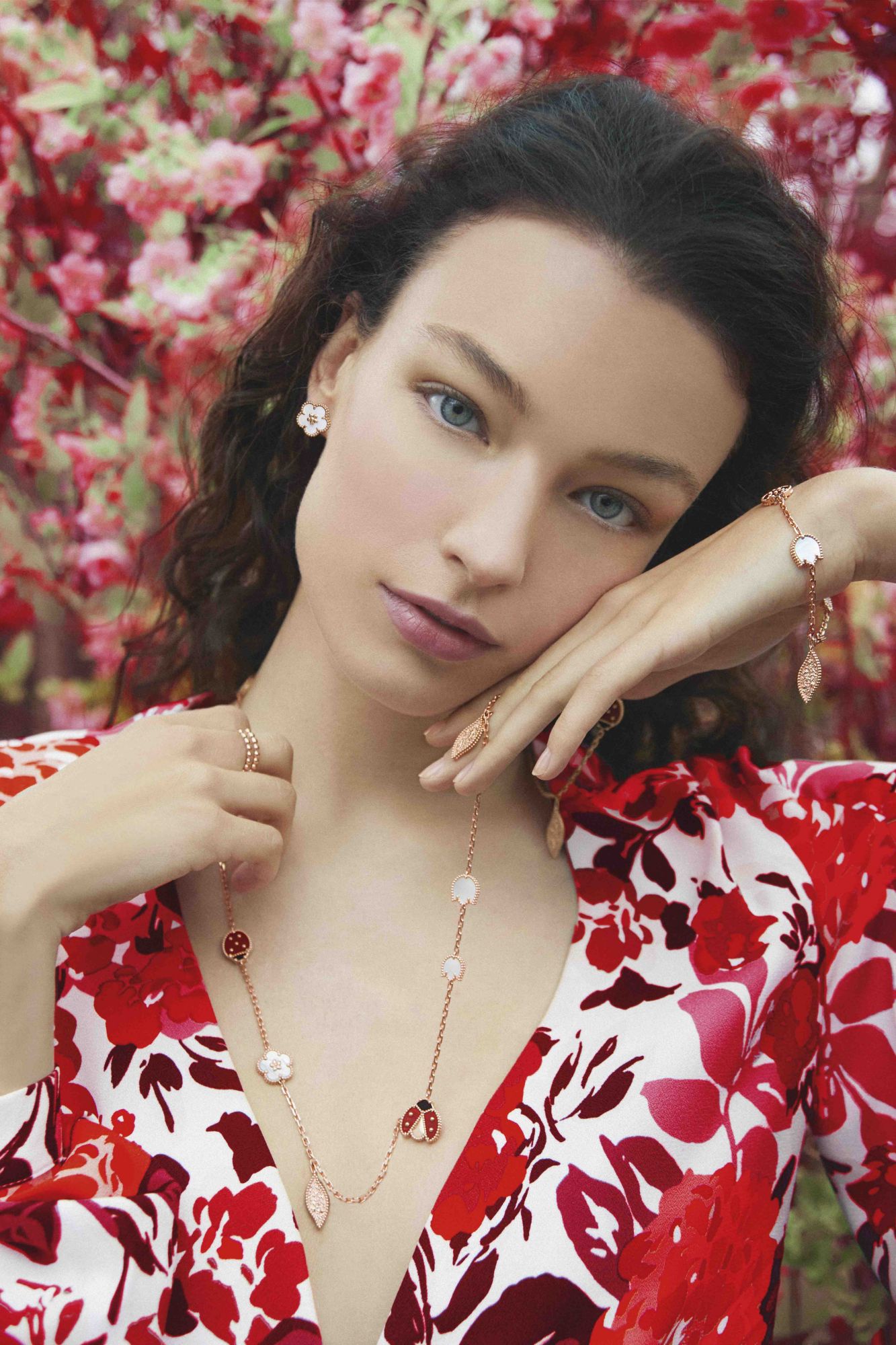 Photo by Erik Madigan Heck - Spring shooting 2021Lucky Spring earrings, plum blossom, rose gold, white mother-of-pearlPerlée pearls of gold rings, medium model, rose goldLucky Spring bracelet, 5 motifs, rose gold, white mother-of-pearl, carnelian, onyxLucky Spring long necklace, 15 motifs, rose gold, white mother-of-pearl, carnelian, onyx