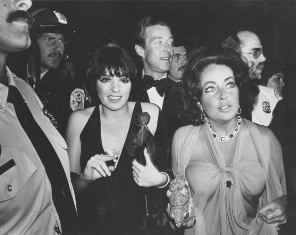 WASHINGTON, DC - UNDATED:Elizabeth Taylor, Roy Halston Frowick and Liza Minnelli are escorted by U.S Park Police in Washington, DC. (Photo by Frank Johnston/The Washington Post via Getty Images)