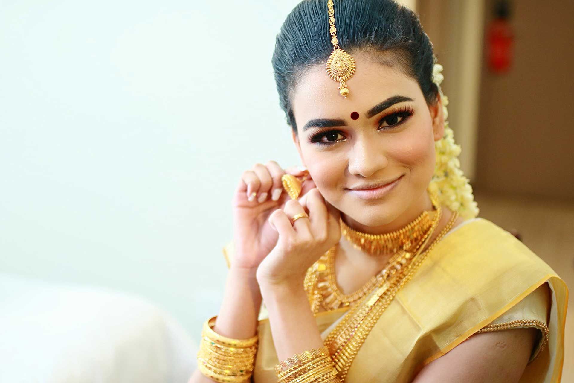 Weighed down in gold, the bride was positively glowing on her wedding day.