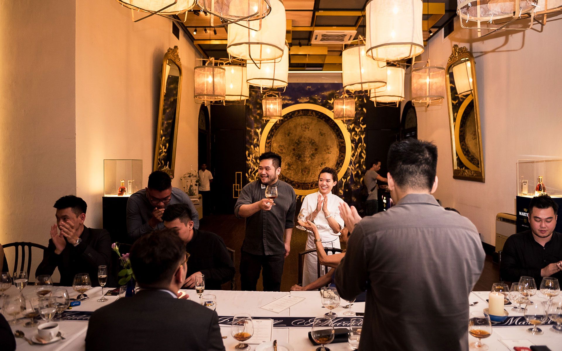 Executive Chef Beh Weng Chia leading a toast at Indigo restaurant.