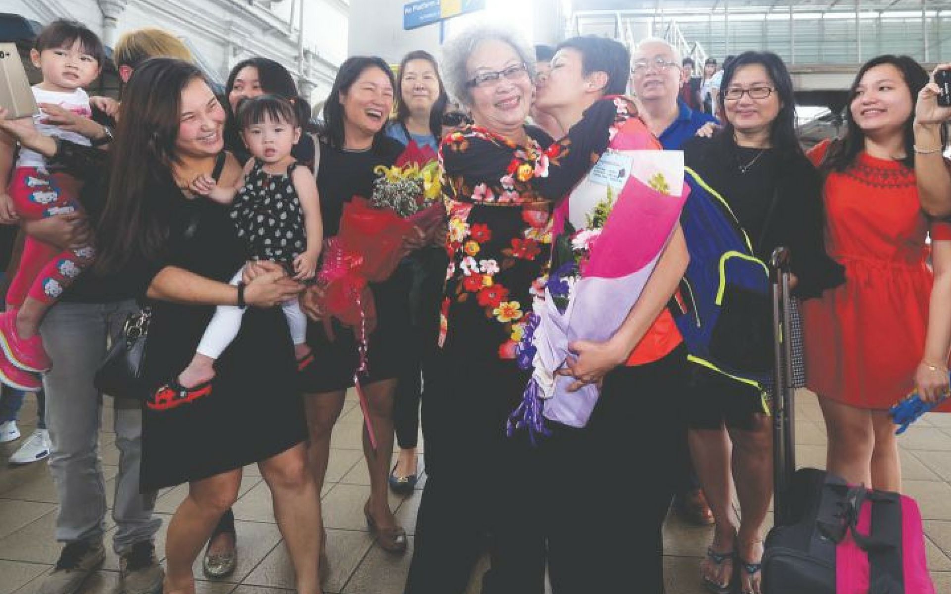 Cheong Jun Hoong being welcome by her friends and family after the Olympics. Photo by Farhan Najib Yusoff.