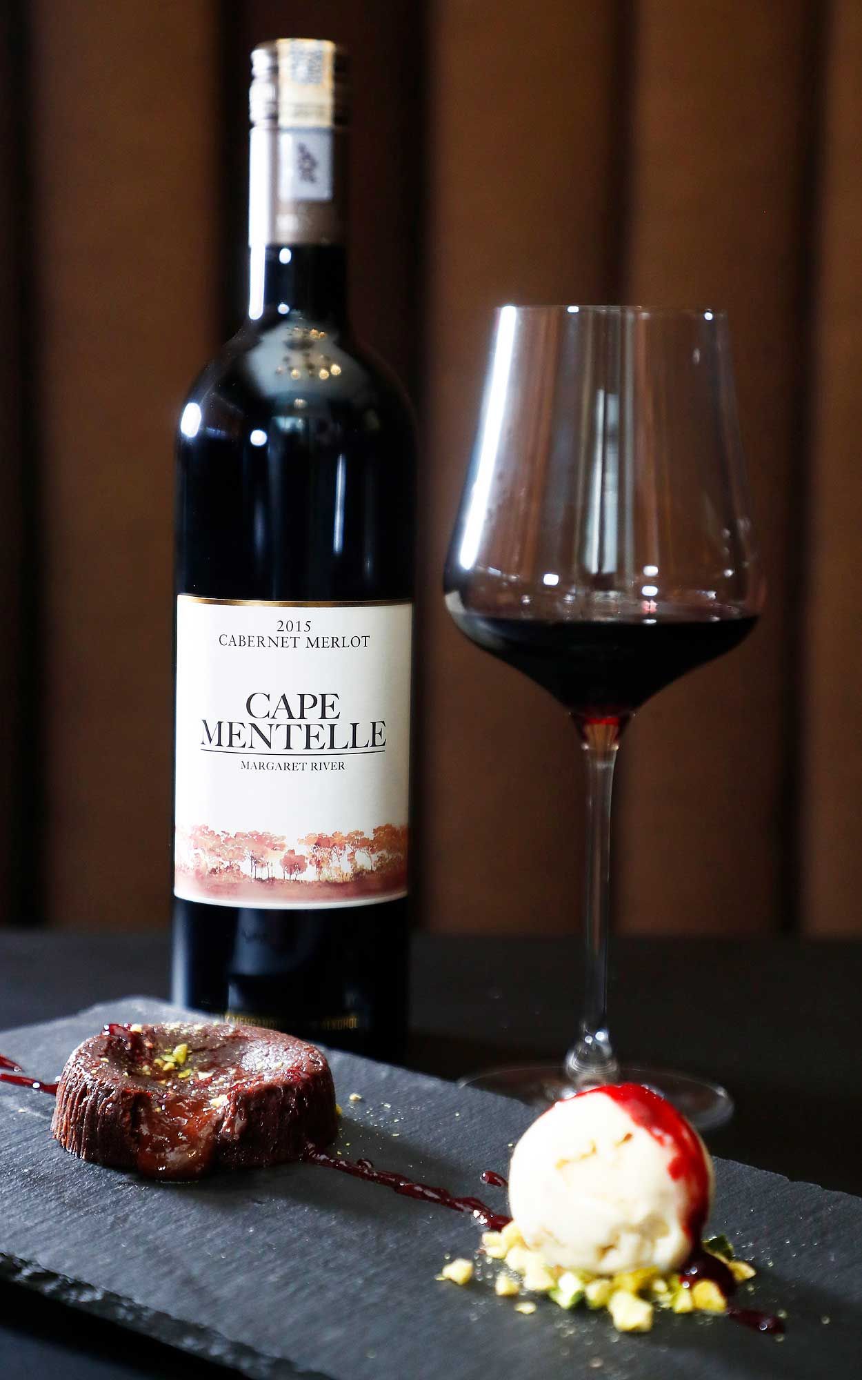 The Cape Mentelle cabernet Merlot 2015 paired with chocolate lava cake, raspberry coulis, pistachio, and rum & raisin ice cream. Photo: Credit Bonnie Yap