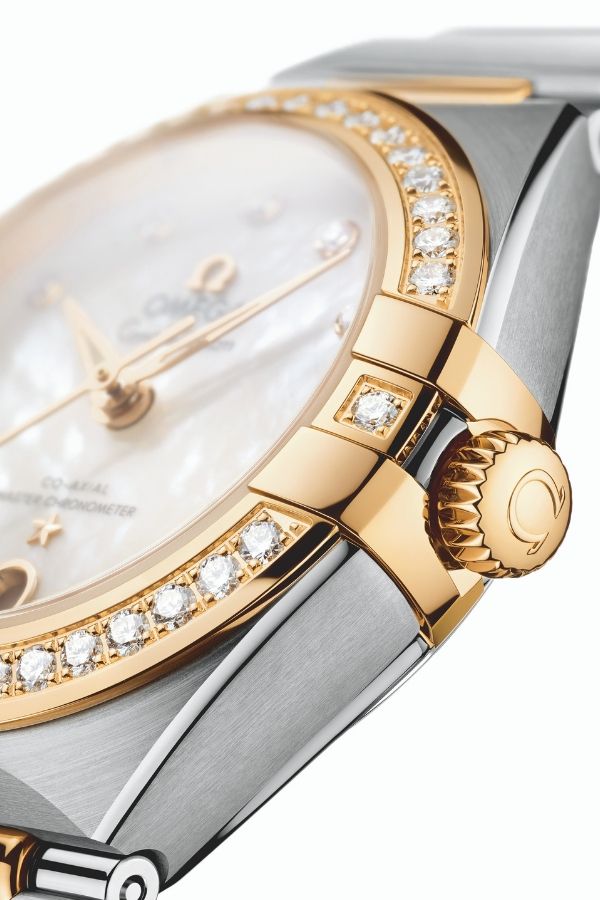 More refined details including slimmer bezel and claws as well as a crown with half-moon teeth (Photo: Omega)