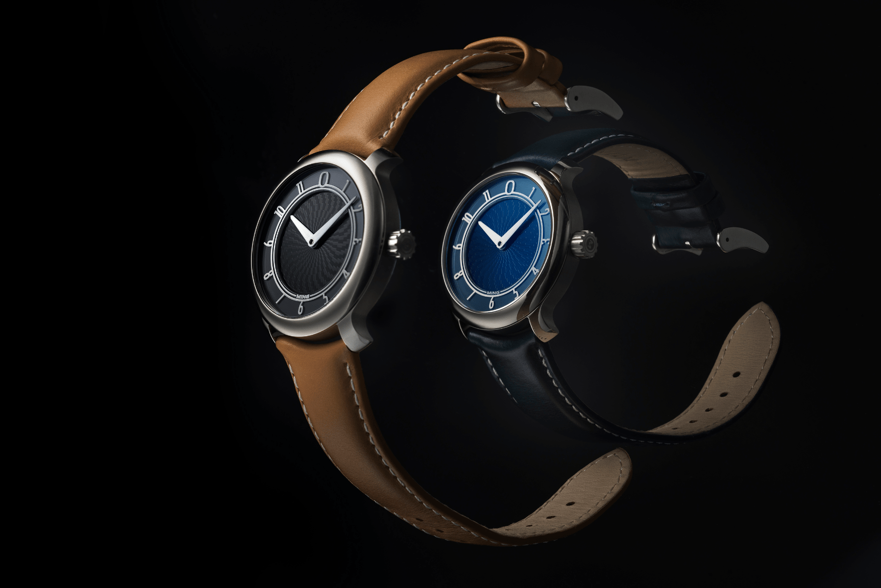 MING's first releases, the 17.01 in grade 5 titanium with blue and anthracite dials. (Photo: MING)