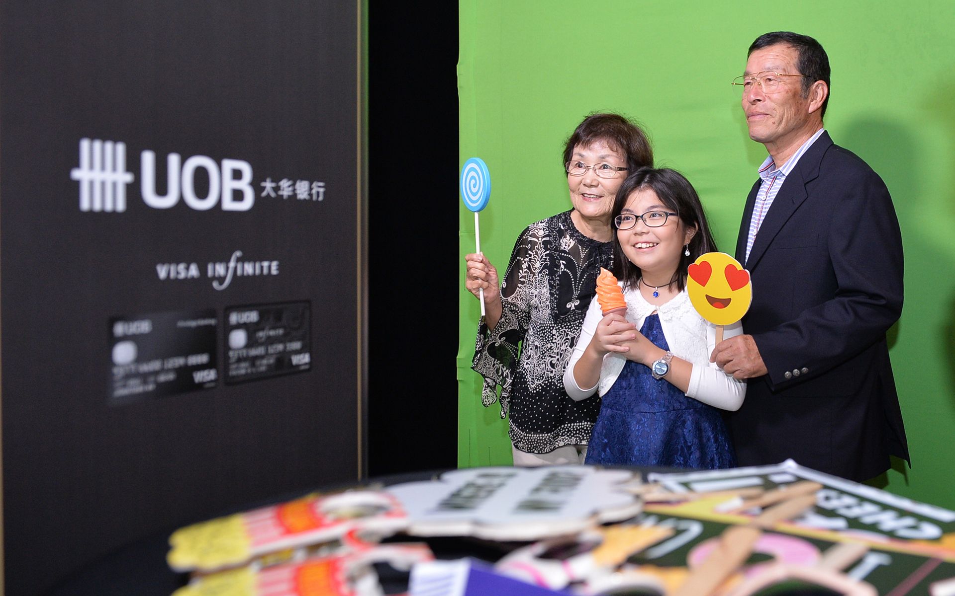 Satako, Yoshiao and Hima Kimura getting snap happy at the UOB photobooth