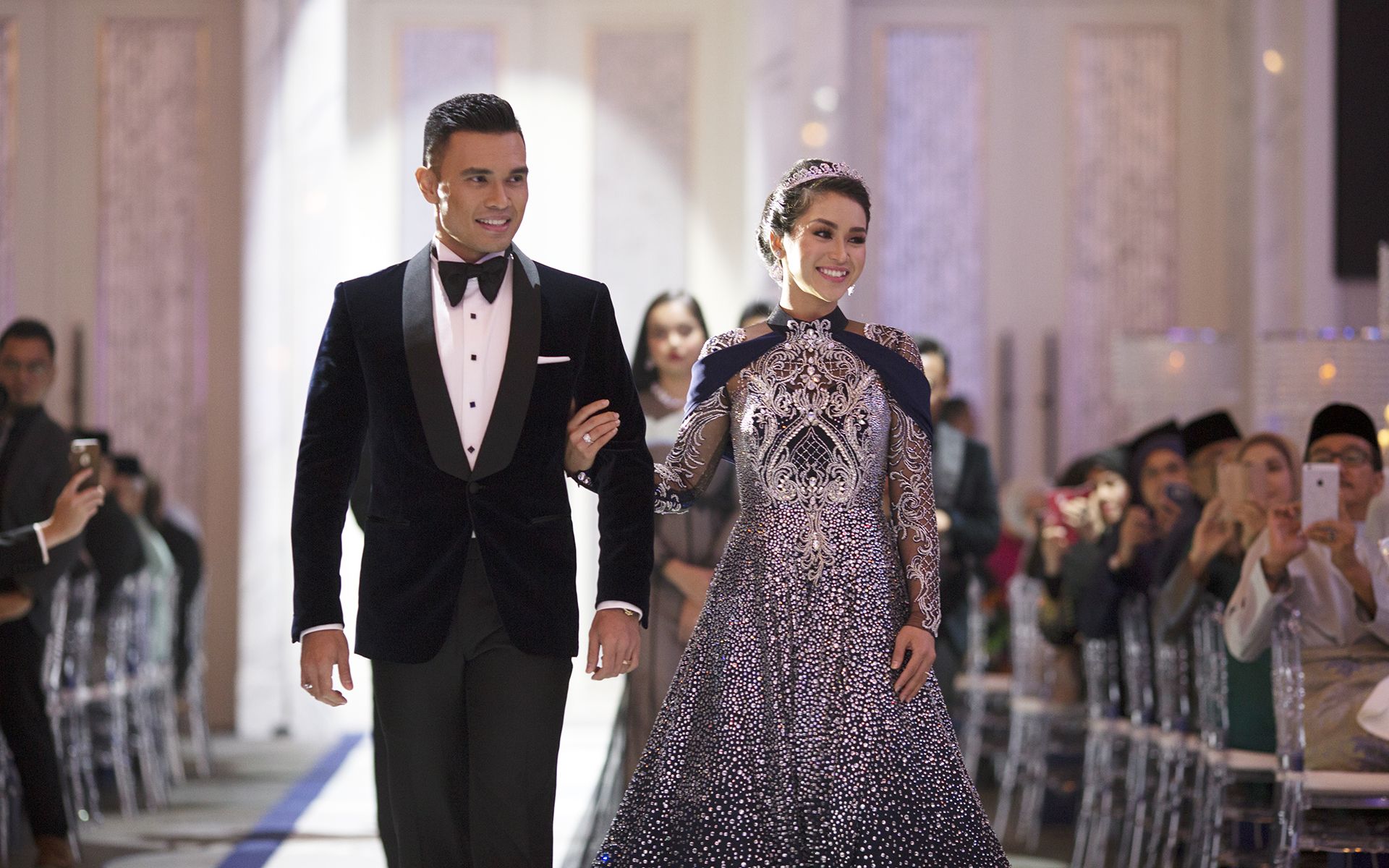 The bride and groom marching down the aisle as husband and wife