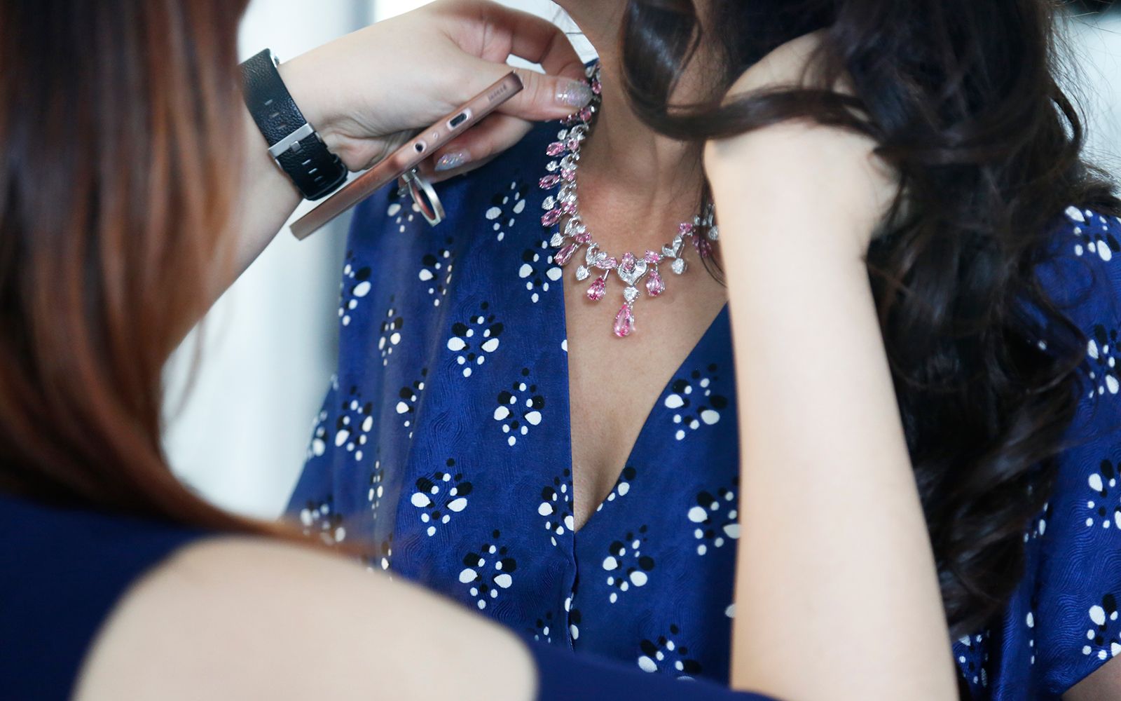 Putting a finishing touch on the pear shape pink spinel necklace by DeGem for the cover shot.