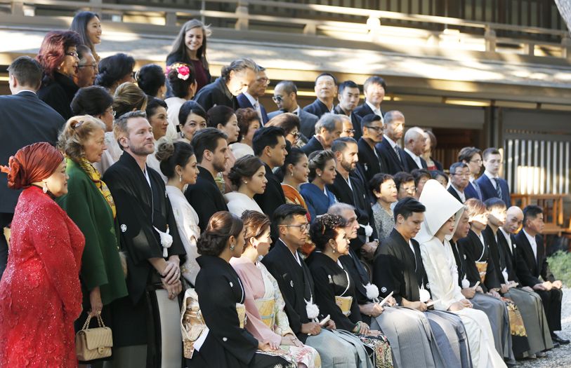 The couple pose together with their family members and friends invited for the ceremony