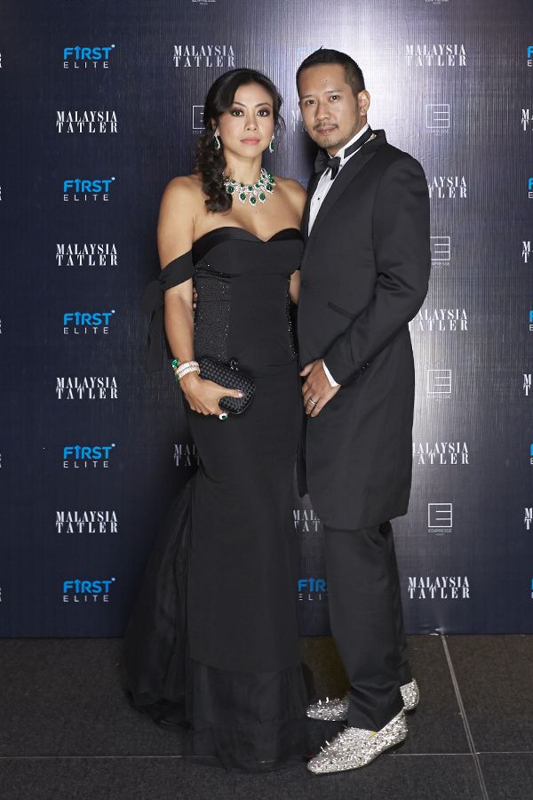 Datin Sabrena Dani in Innai Red and Datuk Wira Dani in Ozwald Boateng tuxedo and Christian Louboutin shoes