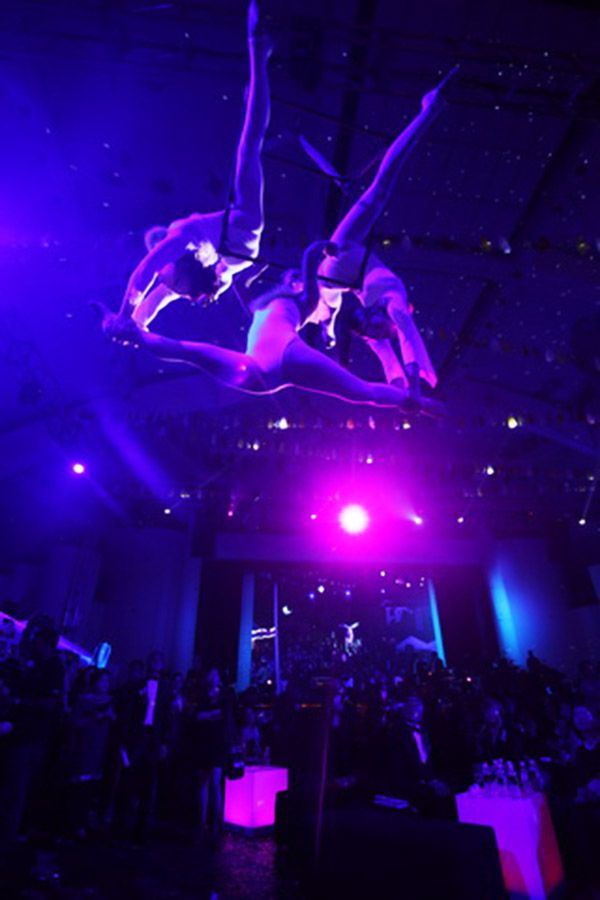 Trapeze artists performing some tricky acts for the guests.