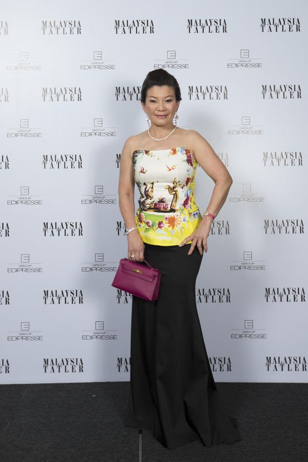 Datin Kate Ong in a beautiful printed peplum top and black skirt (2012)