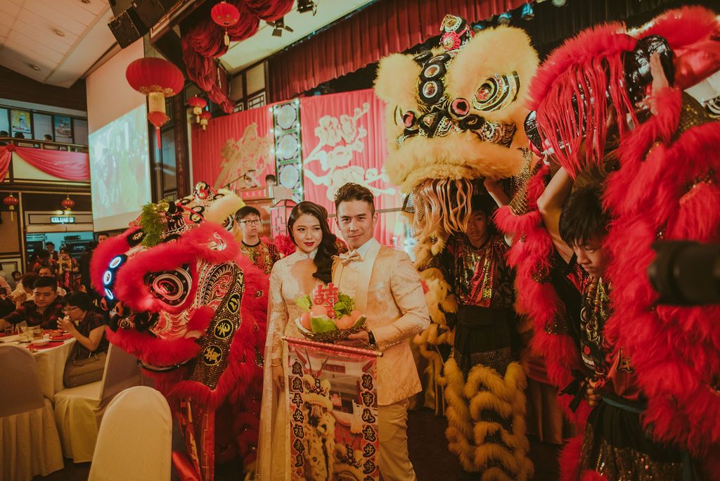 The groom's appreciation for the art of lion dance was incorporated into their wedding theme