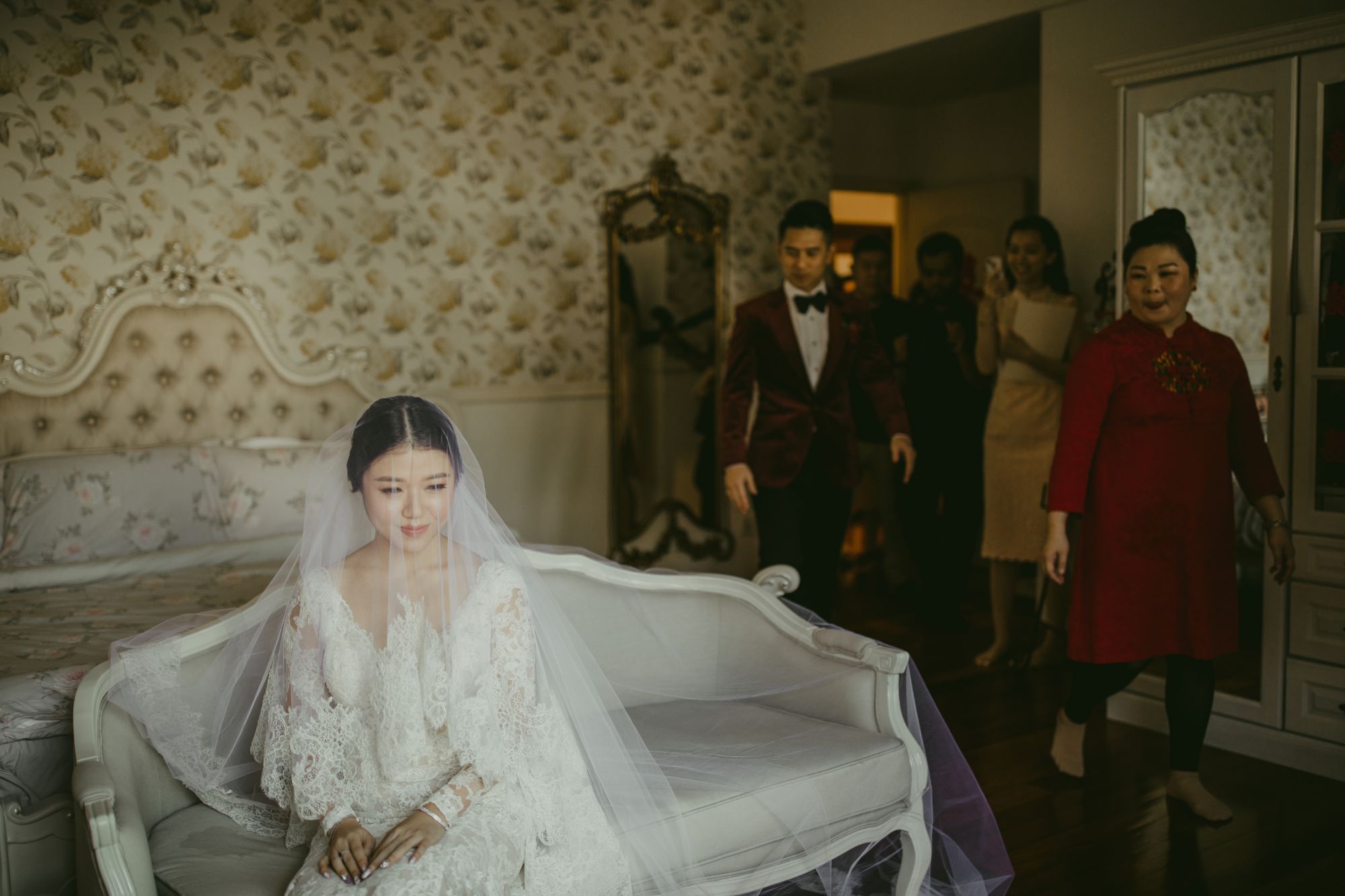 The bride was a demure sight in a layered gown with wide sleeves