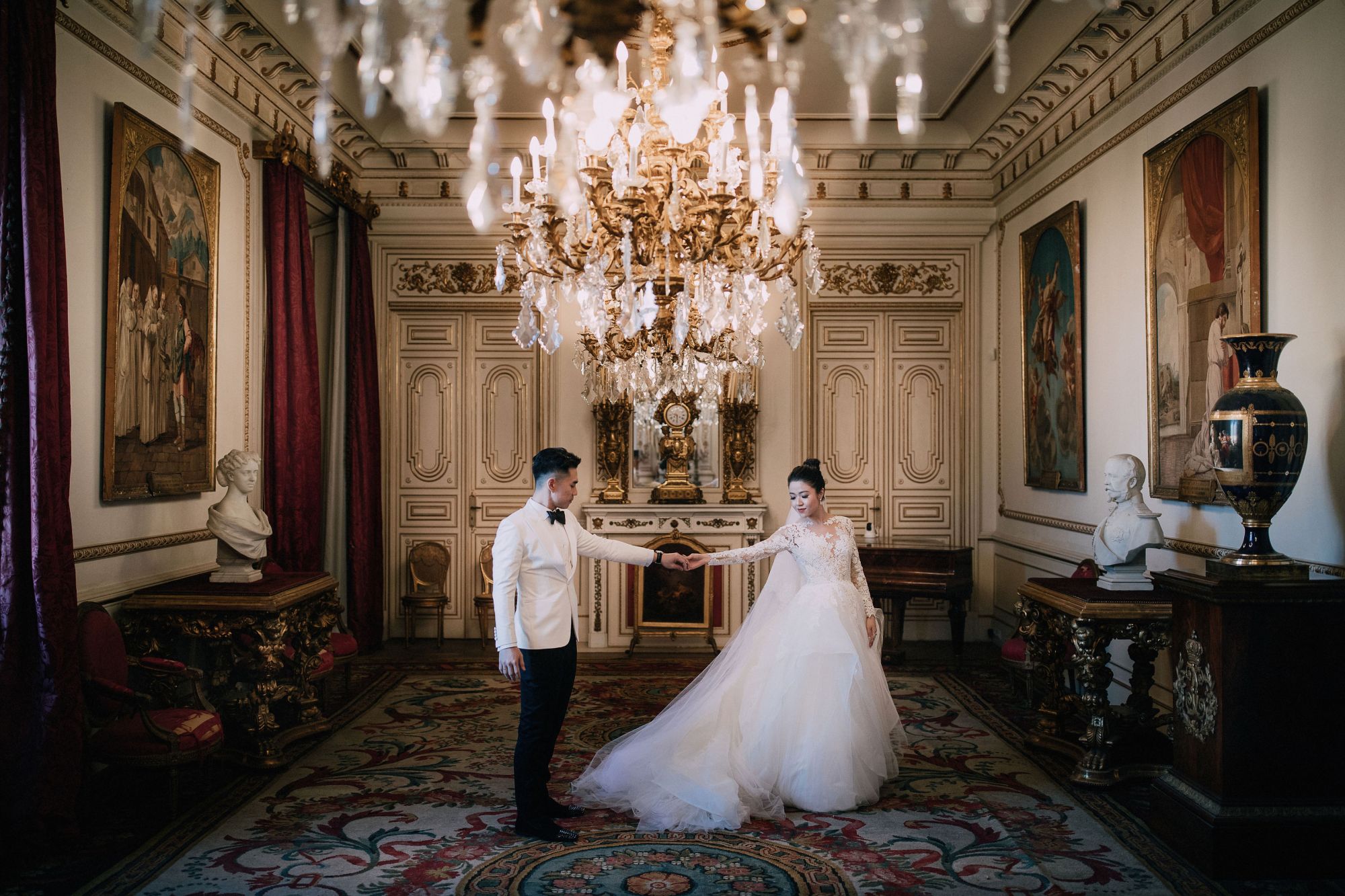 The newlyweds share their first dance at the grand hall of the palace