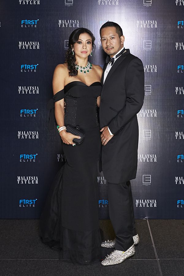 2015 November, Tatler Ball: Supporting local on the red carpet, Datin Wira Sabrena looks every inch the belle of the ball in a heart-shaped neckline Innai Red, complemented by her husband Datuk Wira Wira Dani in Ozwald Boateng tuxedo and Christian Louboutin shoes