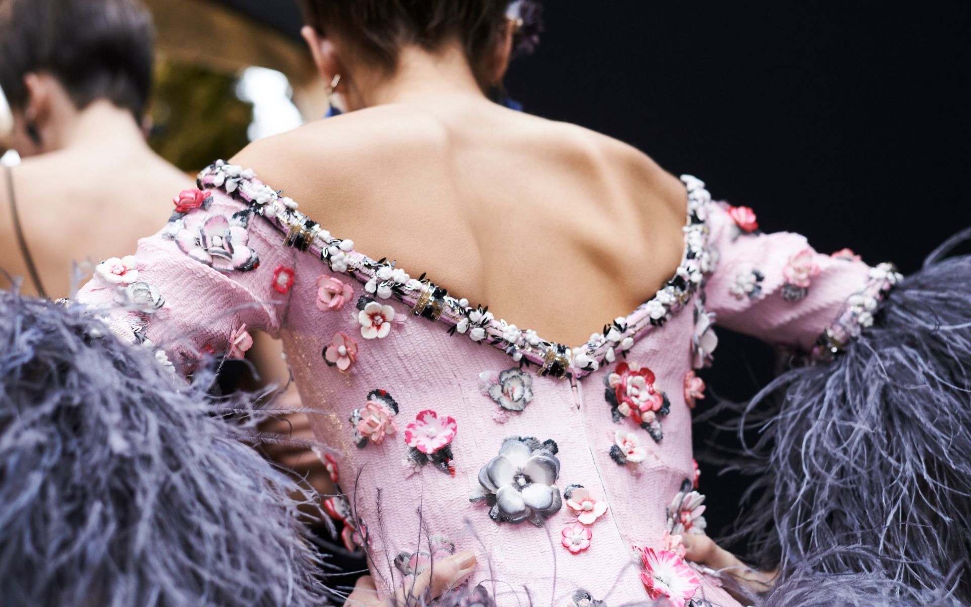 Chanel's Metiers d'Art ateliers have also hand-painted some ceramic flowers sewn onto the dresses (Photo credit: Chanel)