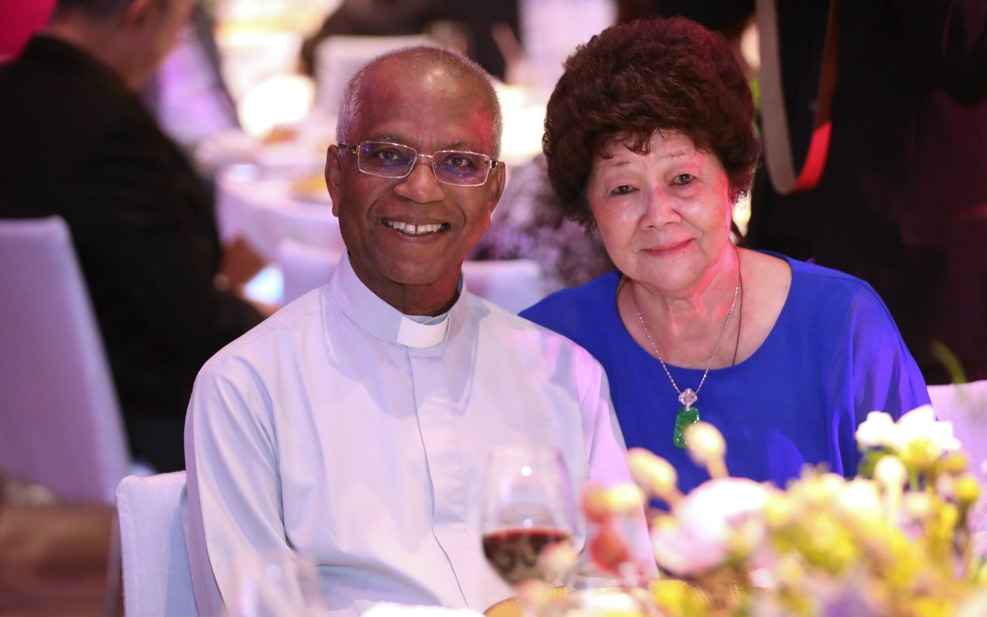 Father Lawrence Das and Annie Beltran