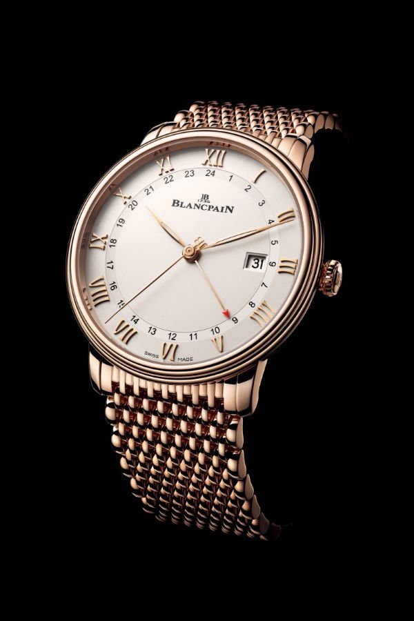 The GMT Date in red gold with mesh bracelet