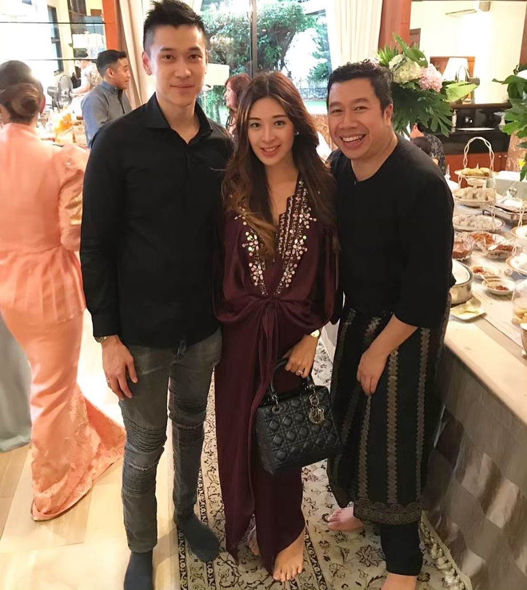 Elizabeth Thea and her husband Jannio Shun mark their first open house of the year at Ferhat Nazri Aziz's home. (Photo credit: @elizabeththea / Instagram)