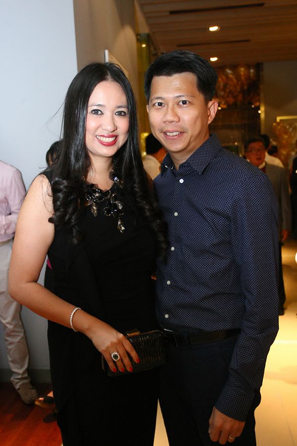 2013, May: Datin Yvette and Datuk Michael Tang at Tan Sri Danny Tan's 60th birthday. Datin Yvette accessorised her black dress with collar detailing with a statement ring and pearl necklace