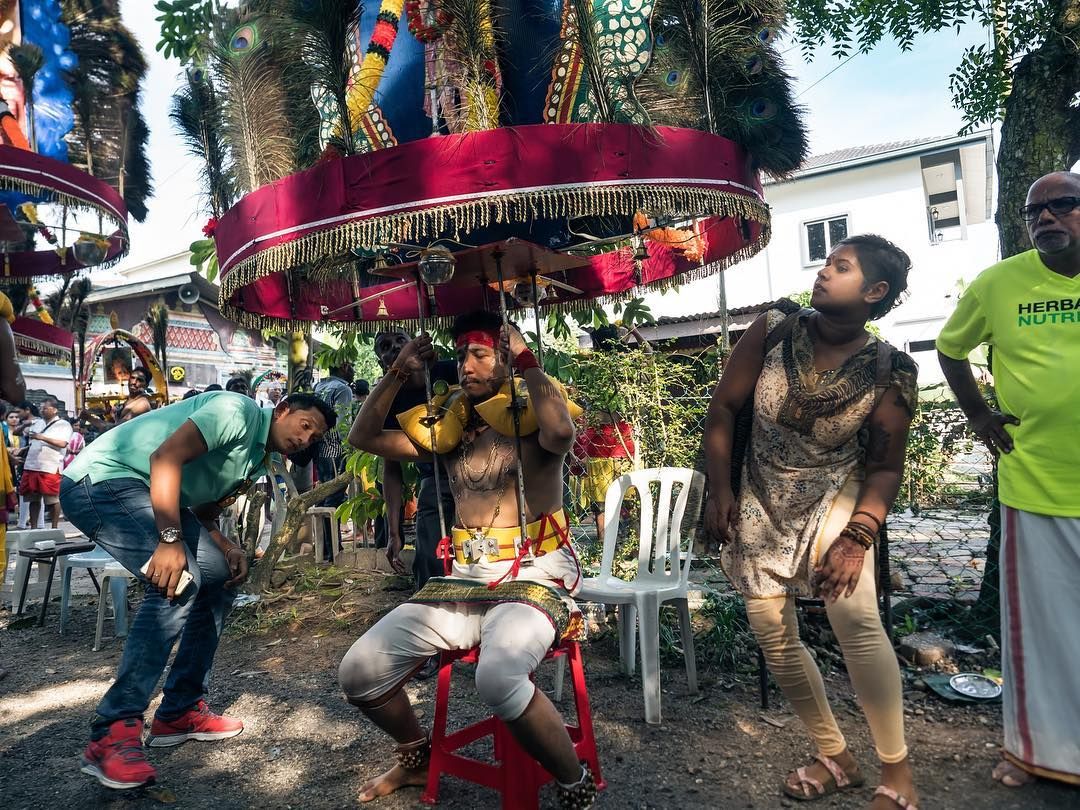 Photographing the kavadi bearer, Francis Wolf (Photo credit: @borninmalaysia / Instagram)