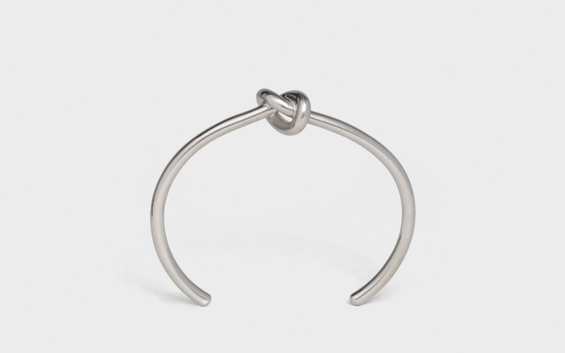 Slither into the night with this simple, yet stunning knot bracelet from Celine. Photo: Celine