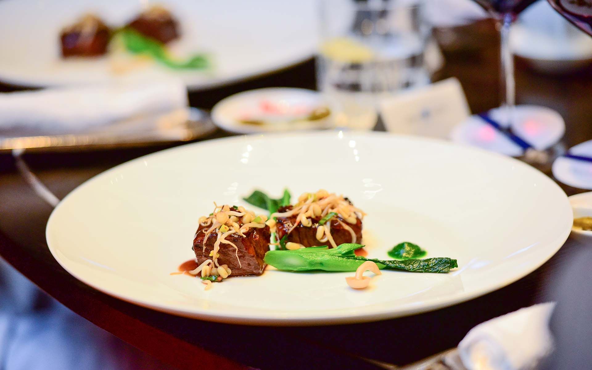Stir-fried Wagyu beef with X.O. purée, Chinese broccoli and rice crackers