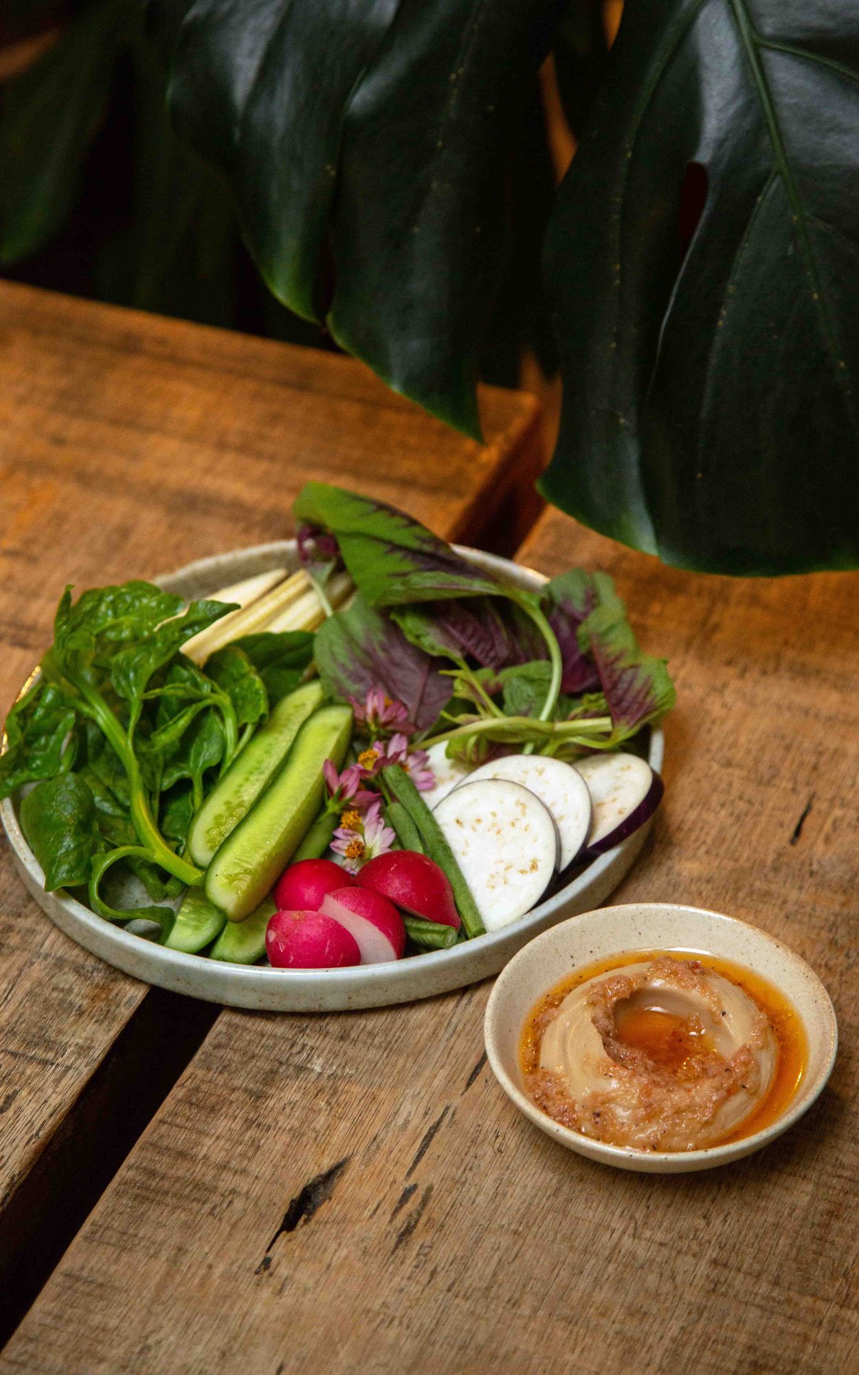 Flowers & leaves served with jackfruit seed cream & cincalok dressing