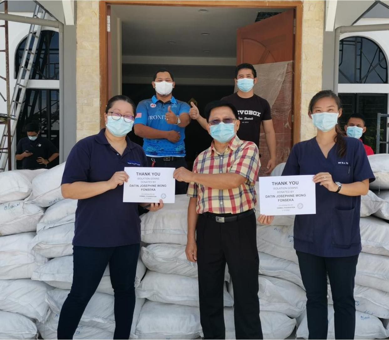 Photo: Isolation gowns presented to Sabah Health authorities earlier this month. (Osimal Foundation/Facebook)