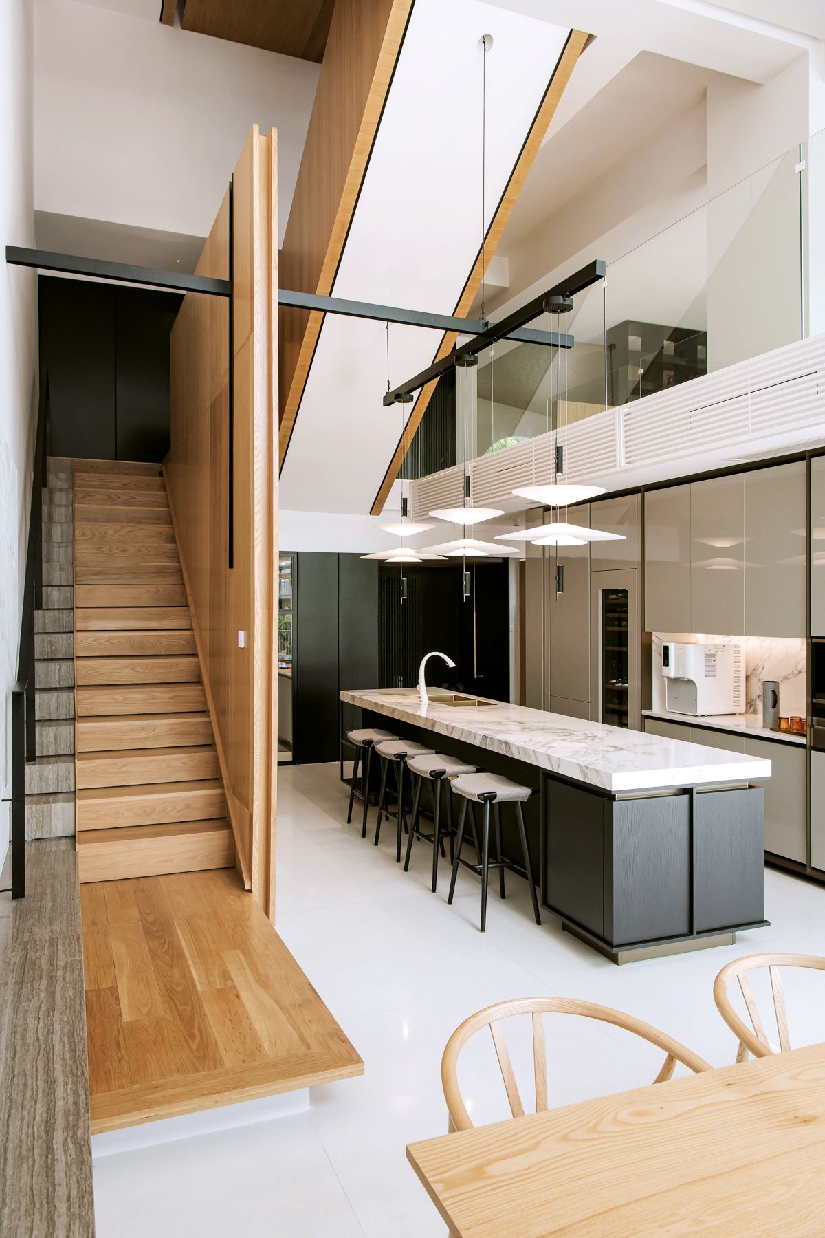 The dry kitchen has an extended volume that draws views from the gantry above